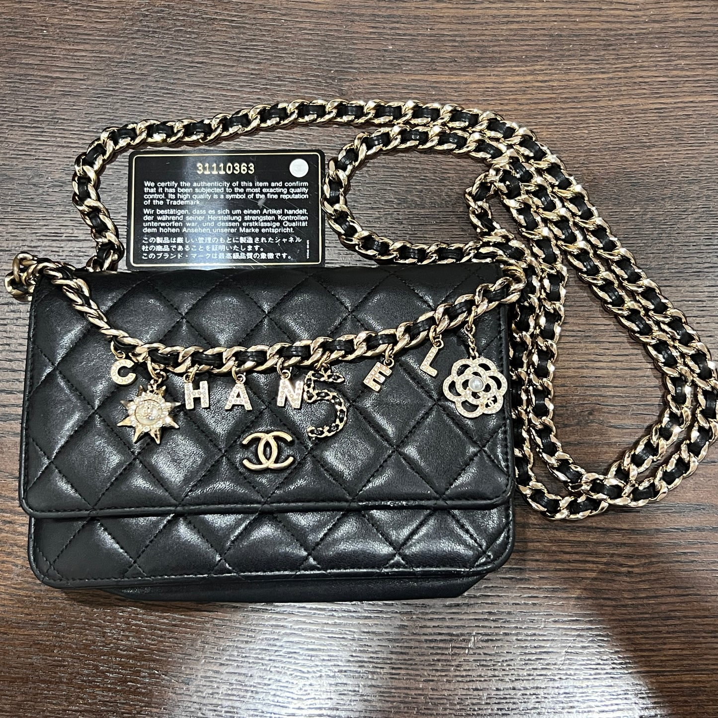CHANEL Black Wallet on Chain (WOC) Coco Charm Lambskin