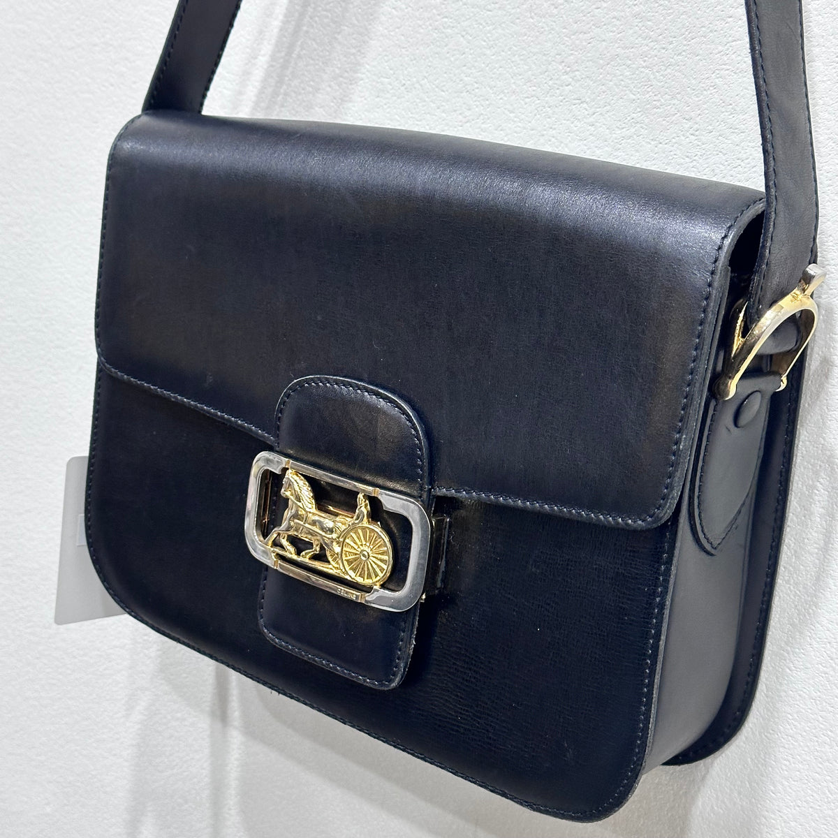 CELINE  Vintage Celine Horse Carriage Buckle Shoulder Bag in Dark leather with a Signature Gold-and-Silver Tone Sulky Horse-and-Carriage Front Clasp