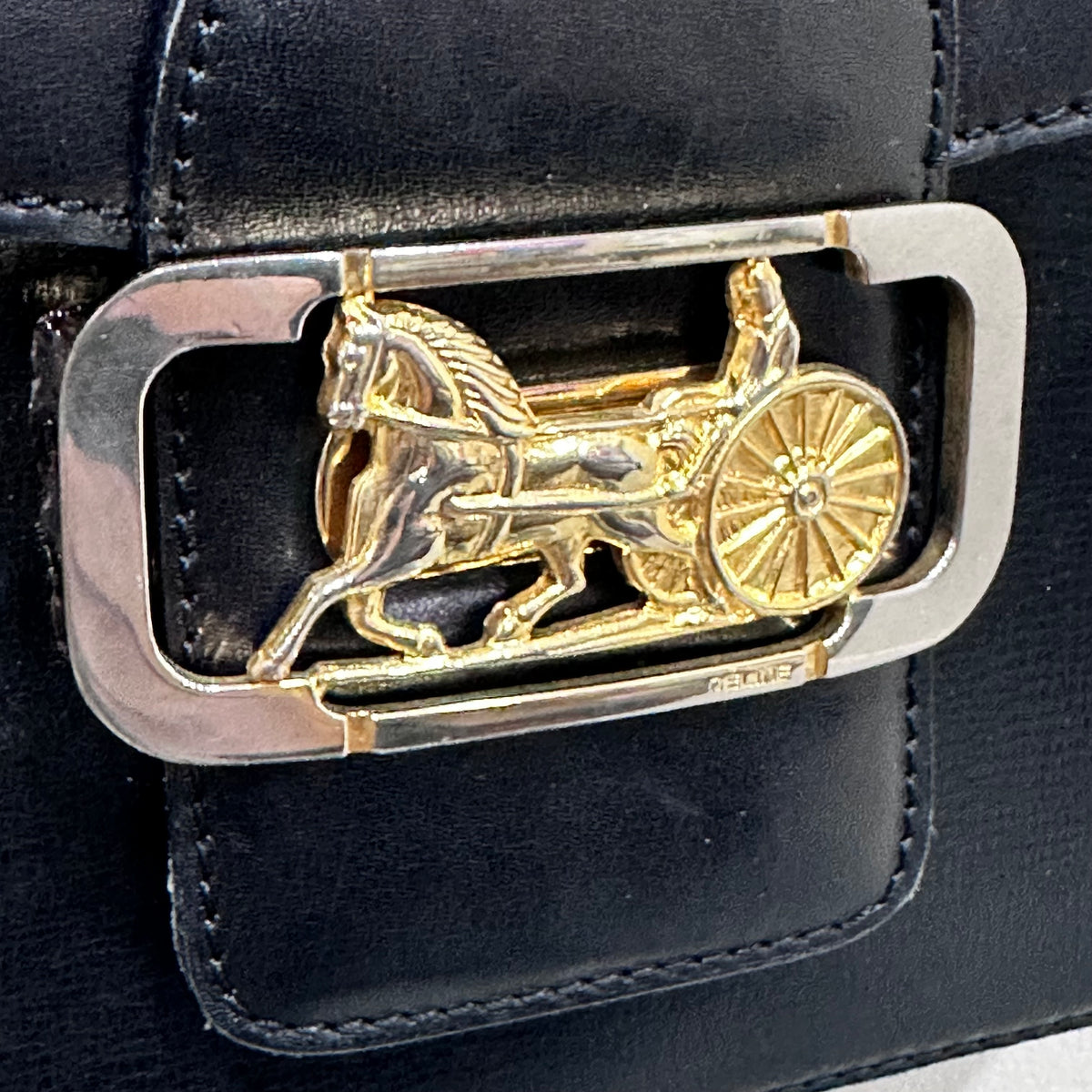 CELINE  Vintage Celine Horse Carriage Buckle Shoulder Bag in Dark leather with a Signature Gold-and-Silver Tone Sulky Horse-and-Carriage Front Clasp
